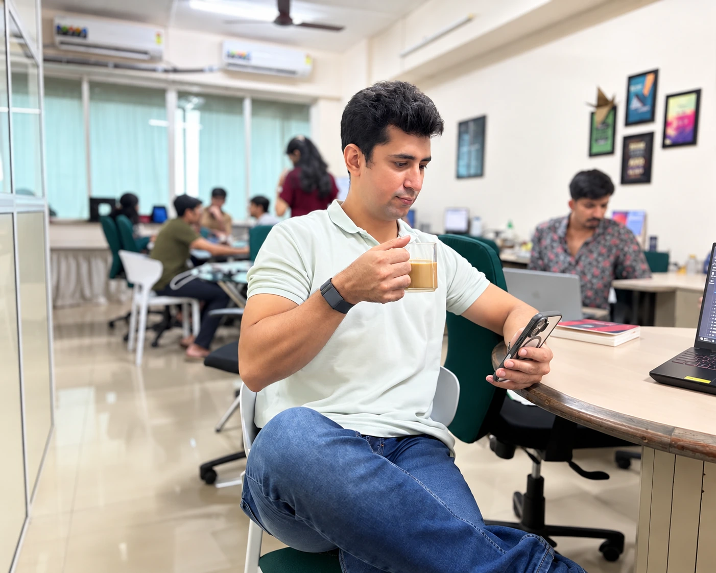 iDigitize team member checking his phone at the office